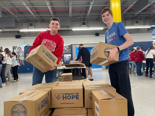 School of the Ozarks students load pallets of kits to be sent across the world. 
